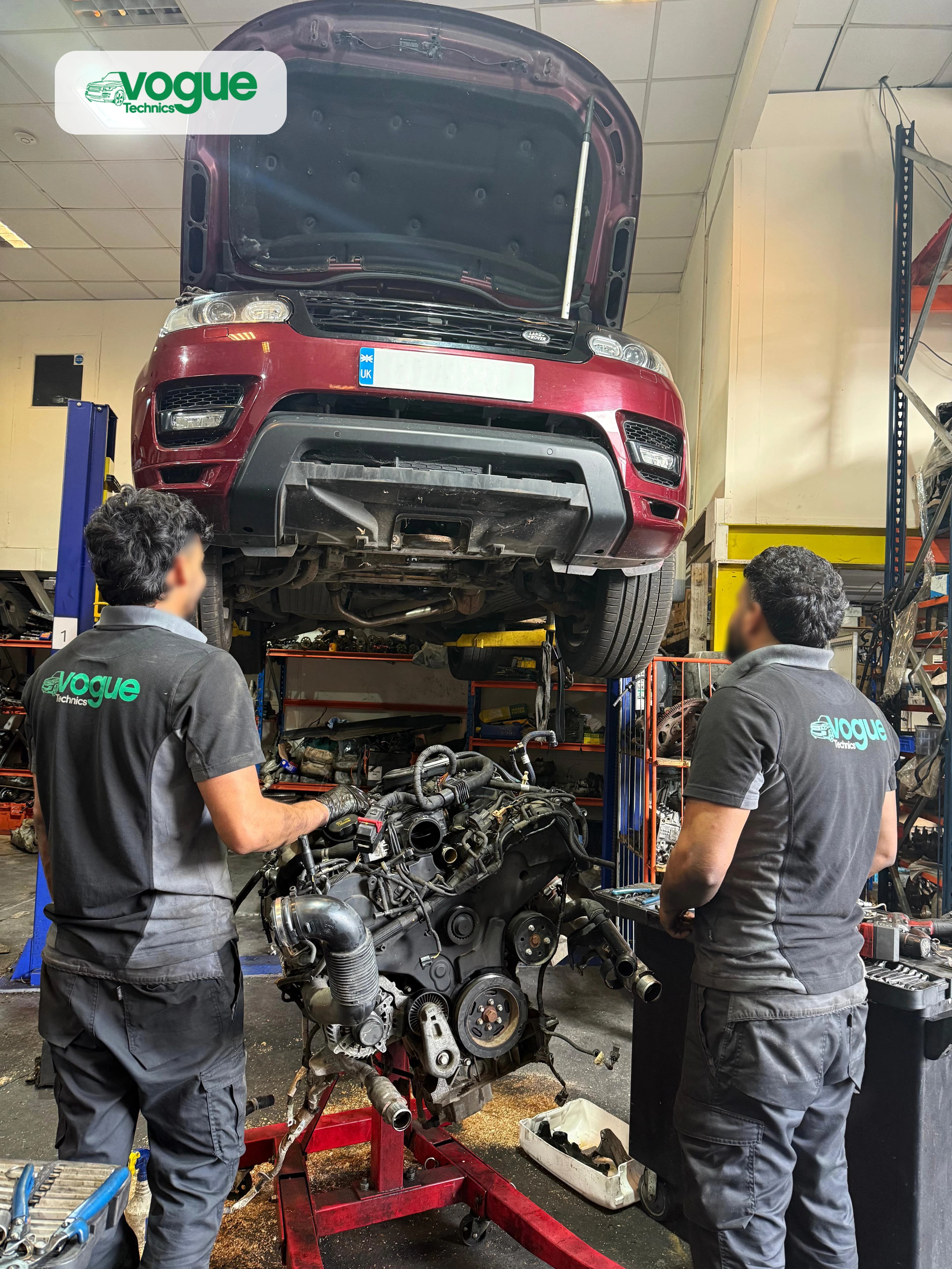 Expert JLR technician working on Land Rover engine at Vogue Technics specialist garage, Grays Essex